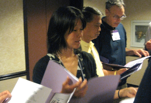 Phuong Quach gets debriefed on the issues at the Advocacy Forum