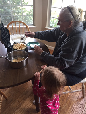 Bonnie who is living with Alzheimer's makes waffles with her granddaughter 