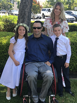 Kirsten and her family pose for the camera.