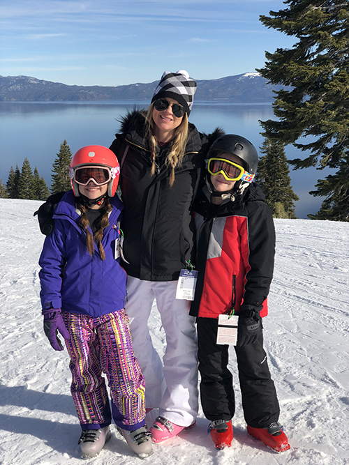 Kirsten Guanella and her children skiing