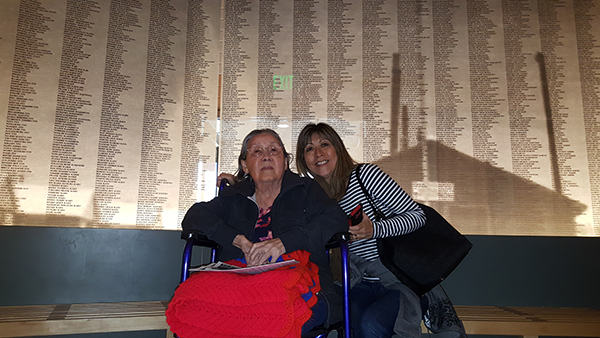 Janice and her mom stand in front of the wall of names at Manzanar.