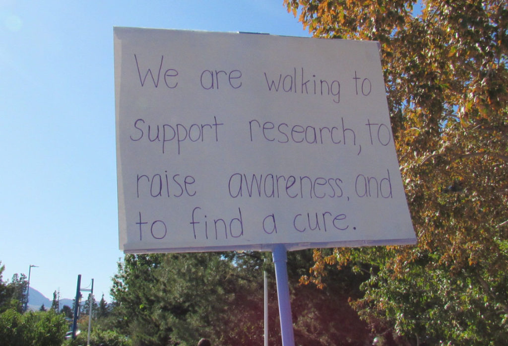 A sign at the 2019 Reno Walk to End Alzheimer's that says they support research