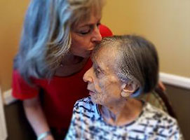 Nancy kisses her mom Helen who is living with Alzheimer's