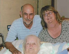 Terry and John pose with Margie who was had Alzheimer's