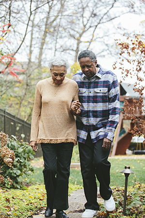 Husband and wife with Alzheimer's walk together 