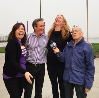 Vanessa and her dad, who is living with Alzheimer's, laugh with KPIX reporter