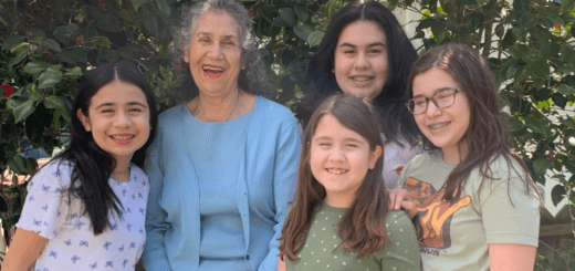 Maria, surrounded by her four granddaughters