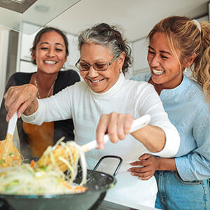 Dementia caregivers spend time with family cooking and having fun 
