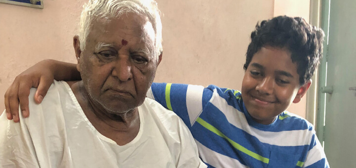 Rohan sits with great grandfather Kerri who had Alzheimer's disease in India