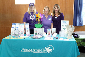 Visiting Angels staff table at Walk to End Alzheimer's 