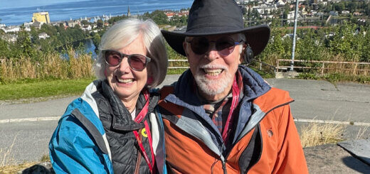 Catherine and Kris who is living with dementia sitting in front of an ocean view