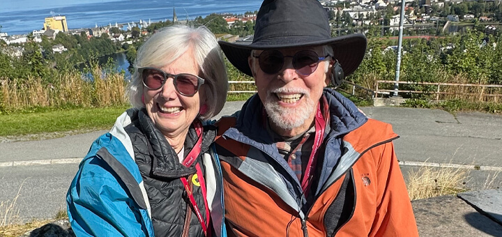 Catherine and Kris who is living with dementia sitting in front of an ocean view