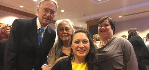 Lili, Olivia, who has Down syndrome and their family at a party